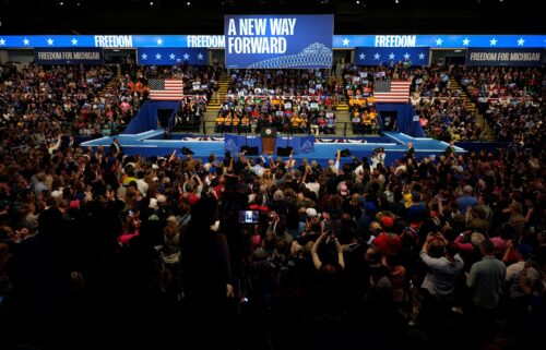 People watch Harris speak in Michigan on October 11.