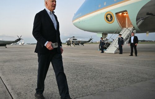 US President Joe Biden walks to speak to reporters after stepping off Air Force One upon arrival at Joint Base Andrews in Maryland on October 3. Biden will no longer travel abroad this week as a major hurricane speeds toward Florida.