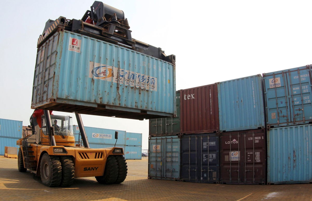 <i>China Daily/Reuters via CNN Newsource</i><br/>A forklift transfers a shipping container for export at a port in Lianyungang