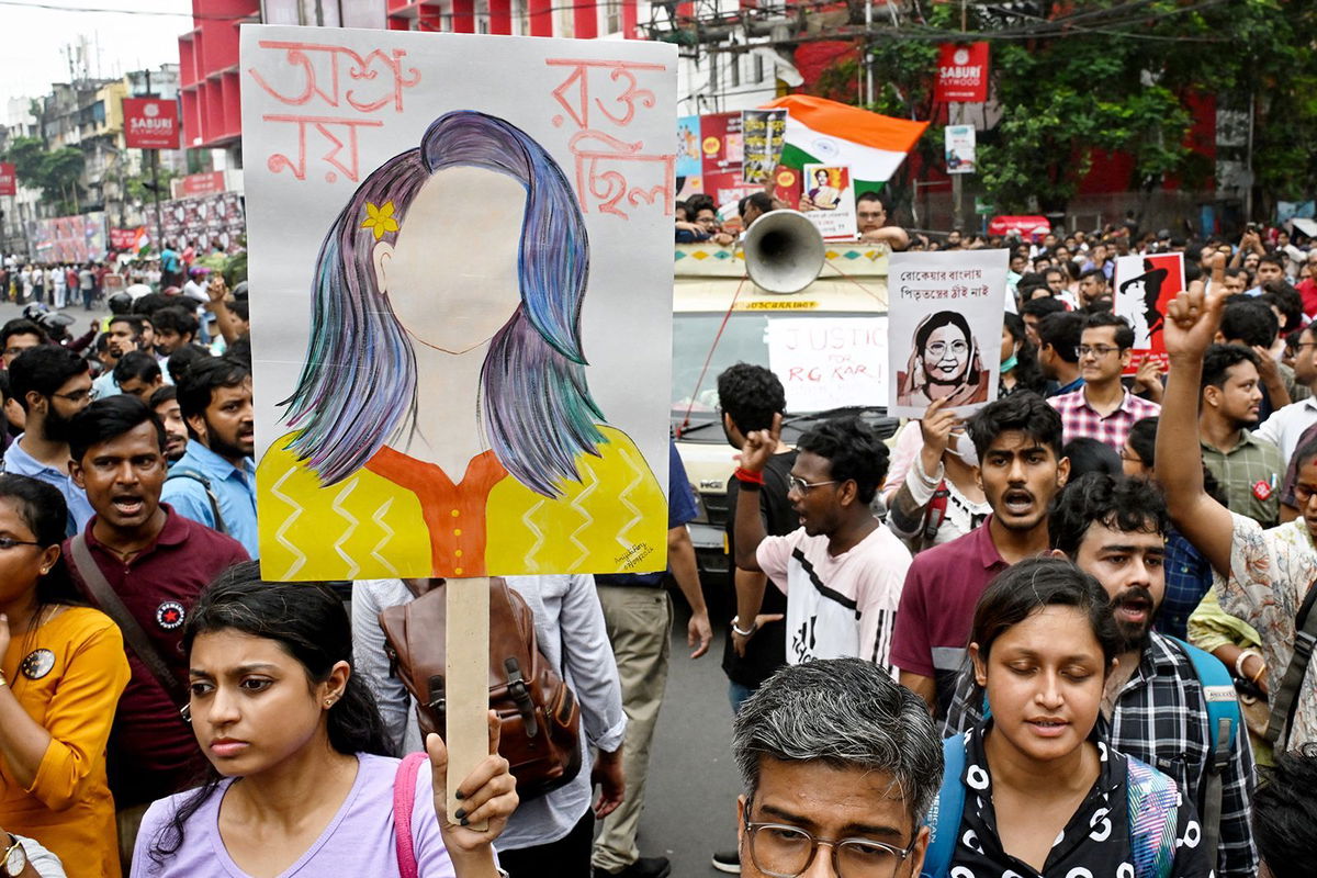 <i>Dibyangshu Sarkar/AFP/Getty Images via CNN Newsource</i><br/>Doctors and social activists march during a rally to condemn the rape and murder of a doctor in Kolkata on October 2.