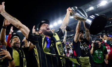 Olivier Giroud hoists the championship trophy after LAFC defeated Sporting Kansas City 3-1 in extra time in the US Open Cup.