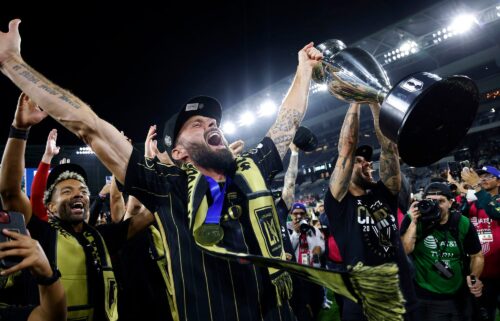 Olivier Giroud hoists the championship trophy after LAFC defeated Sporting Kansas City 3-1 in extra time in the US Open Cup.