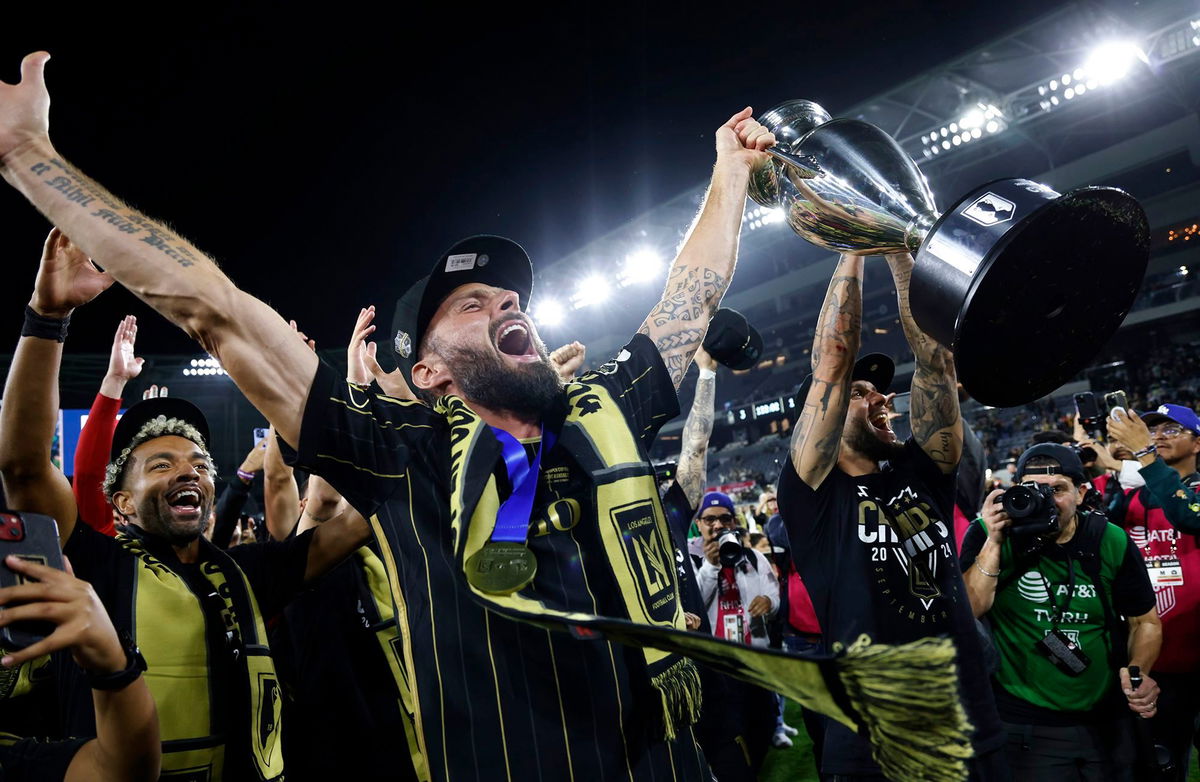 <i>Kevork Djansezian/Getty Images via CNN Newsource</i><br/>Olivier Giroud hoists the championship trophy after LAFC defeated Sporting Kansas City 3-1 in extra time in the US Open Cup.