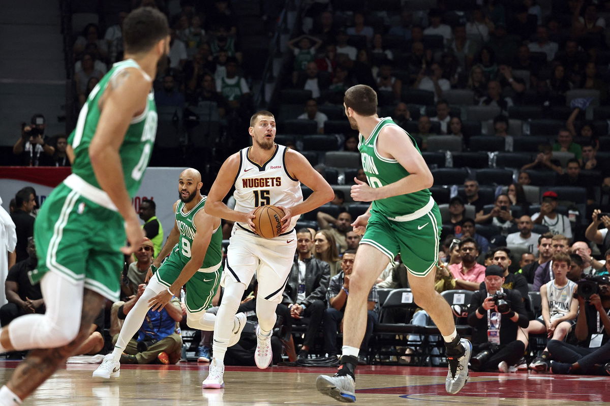 <i>Fadel Senna/AFP/Getty Images via CNN Newsource</i><br/>Jokić looks to pass in the NBA preseason game between the Nuggets and the Celtics.