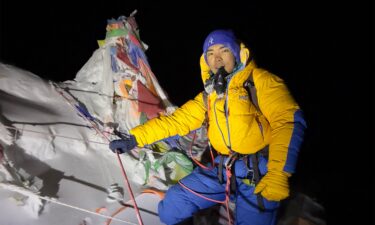 Nepali mountaineer Nima Rinji Sherpa is pictured at the summit of Mount Everest.