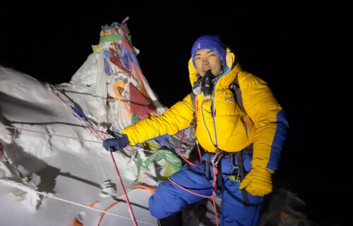 Nepali mountaineer Nima Rinji Sherpa is pictured at the summit of Mount Everest.