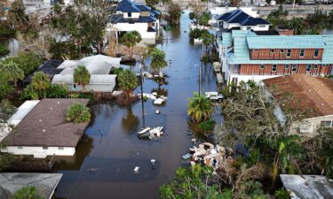 A drone image shows a flooded street due to Hurricane Milton in Siesta Key