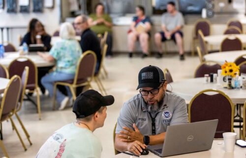 FEMA staff work with local residents affected by floods resulting from Hurricane Helene