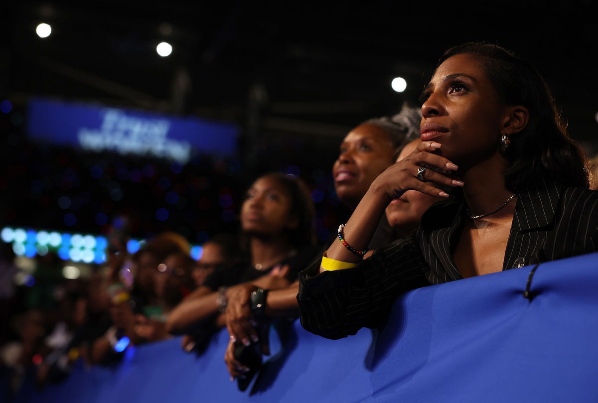 <i>Justin Sullivan/Getty Images via CNN Newsource</i><br/>Supporters look on as Vice President Kamala Harris speaks during a campaign rally at Shell Energy Stadium on October 25 in Houston.