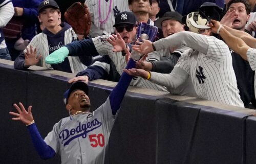 Two New York Yankees fans were ejected from Game 4 of the World Series after ripping the ball from Los Angeles Dodgers star Mookie Betts’ glove.