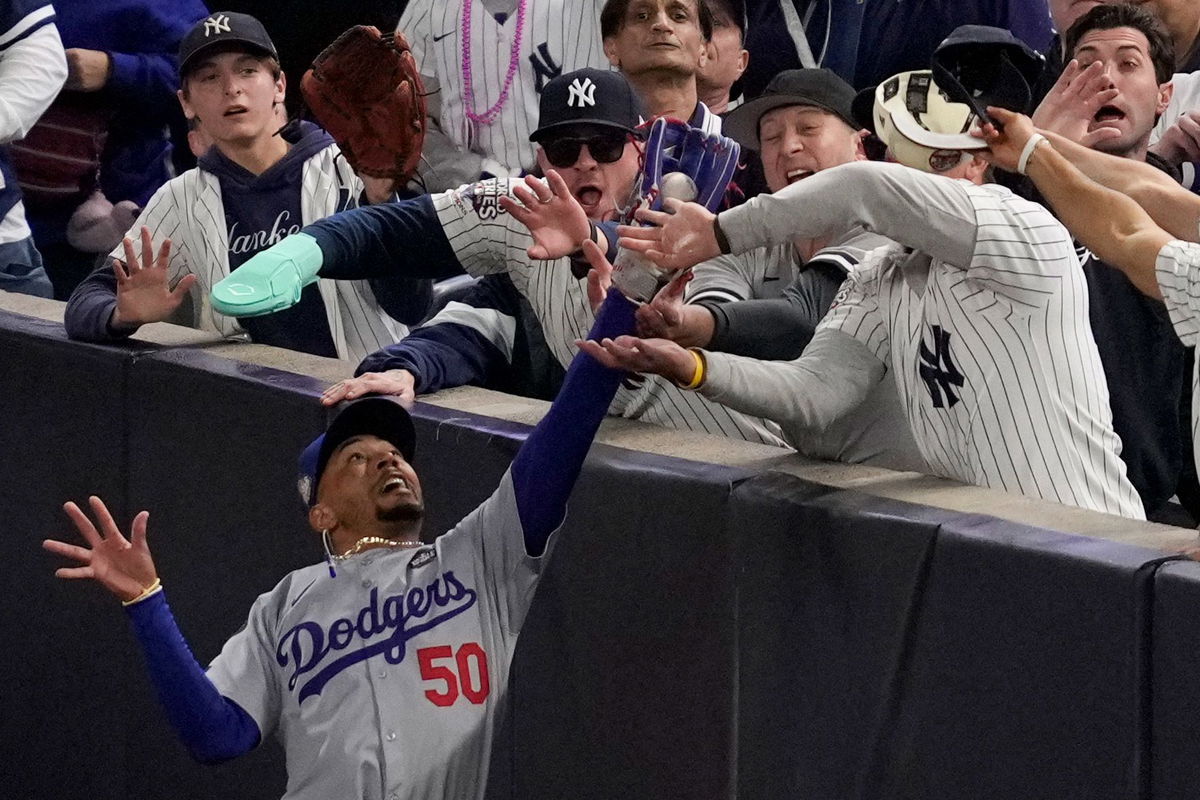 <i>Ashley Landis/AP via CNN Newsource</i><br/>Two New York Yankees fans were ejected from Game 4 of the World Series after ripping the ball from Los Angeles Dodgers star Mookie Betts’ glove.