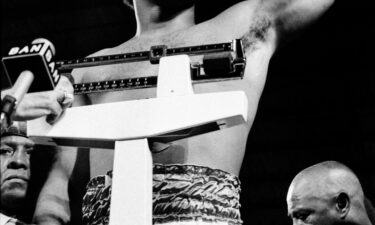 Foreman gestures during the weigh-in on October 29