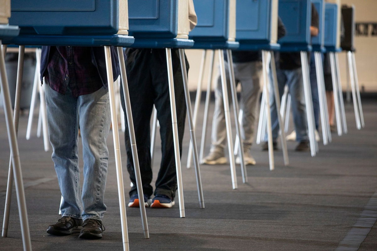 <i>Bill Pugliano/Getty Images via CNN Newsource</i><br/>Voters cast their ballots during Michigan's early voting period on October 29