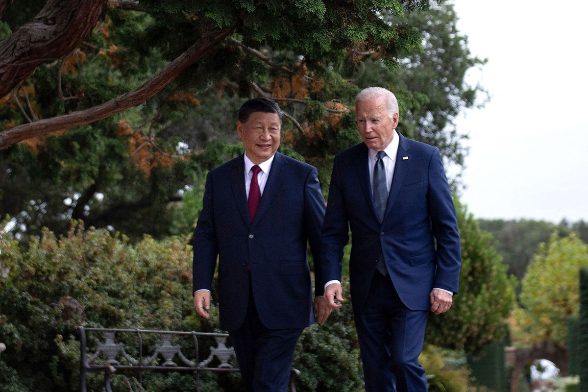 <i>Brendan Smialowski/AFP/Getty Images/File via CNN Newsource</i><br/>Chinese leader Xi Jinping and US President Joe Biden walk together after a meeting on the sidelines of the Asia-Pacific Economic Cooperation Leaders' week in California last November.