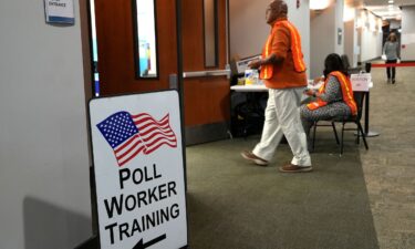 Election workers oversee early election voting at a polling station in Marietta