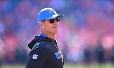 Jim Harbaugh looks on prior to the Los Angeles Chargers' game against the Denver Broncos in Denver