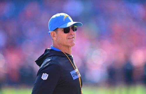 Jim Harbaugh looks on prior to the Los Angeles Chargers' game against the Denver Broncos in Denver