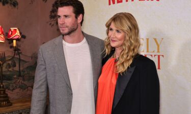 Liam Hemsworth (left) and Laura Dern pictured at a screening of "Lonely Planet" in New York City on October 1.