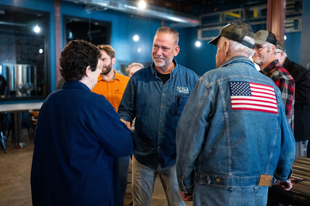 <i>Bill Clark/CQ-Roll Call/Getty Images via CNN Newsource</i><br/>Independent Senate candidate Dan Osborn chats with attendees after speaking during his campaign stop at the Handlebend coffeshop in O'Neill