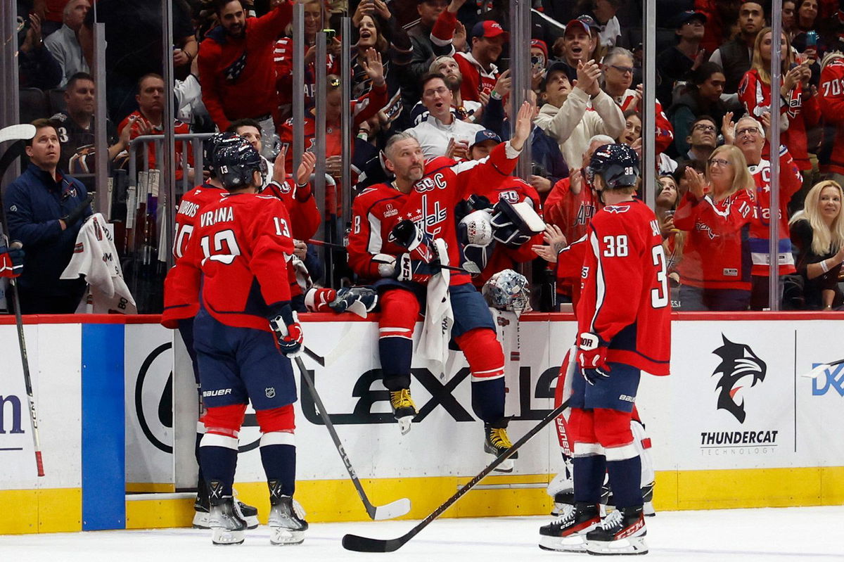 <i>Geoff Burke/USA Today Sports/Reuters via CNN Newsource</i><br/>Washington Capitals left wing Alex Ovechkin waves to the crowd after being recognized for recording his 700th career assist in the game against the Vegas Golden Knights.