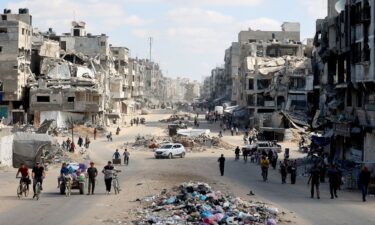 Palestinians carry their belongings as they flee areas north of Gaza City in the northern Gaza Strip on October 12. In recent days