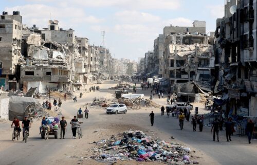 Palestinians carry their belongings as they flee areas north of Gaza City in the northern Gaza Strip on October 12. In recent days