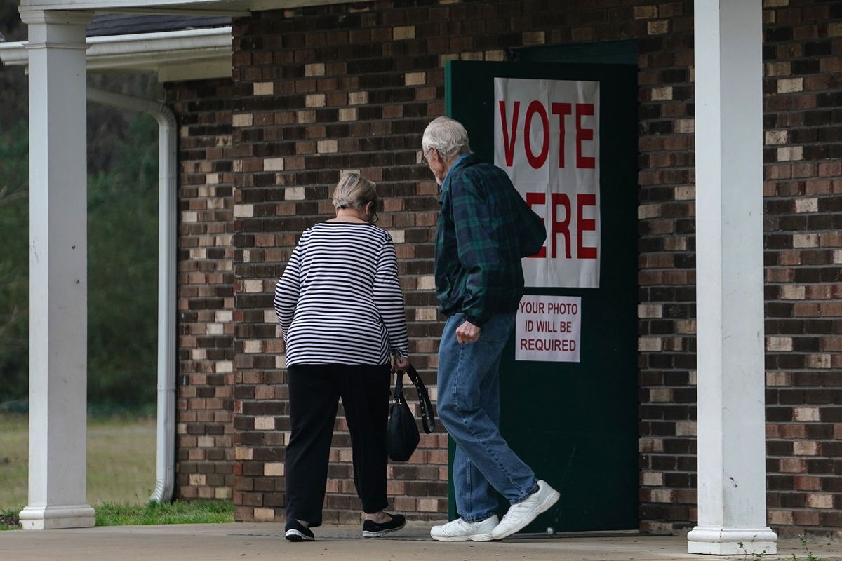 <i>Elijah Nouvelage/Getty Images via CNN Newsource</i><br/>Voters enter a polling location to cast their ballots in the state's primary on March 5