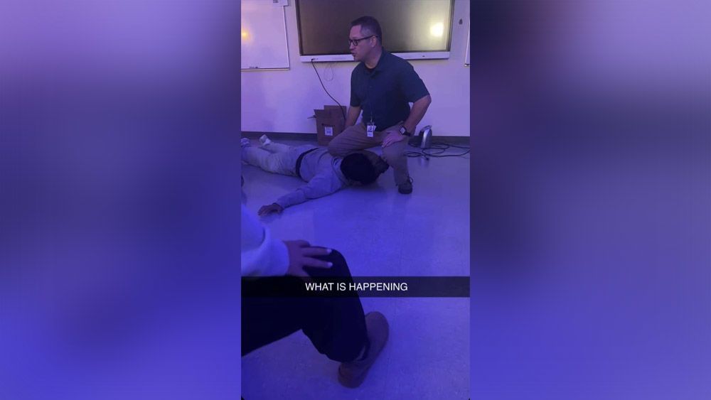 <i>Obtained by CNN via CNN Newsource</i><br/>A photo obtained by CNN shows a substitute teacher allegedly reenacting the murder of George Floyd during English class at a Minnesota high school.