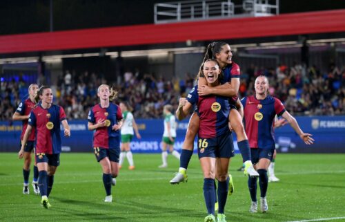 Fridolina Rolfö celebrates with teammate Kika Nazareth after scoring Barcelona's ninth goal from a penalty kick.