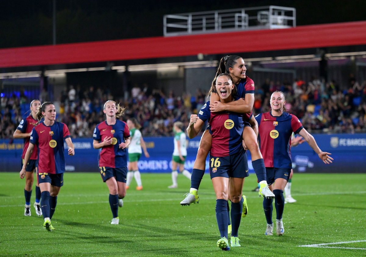 <i>David Ramos/Getty Images via CNN Newsource</i><br/>Fridolina Rolfö celebrates with teammate Kika Nazareth after scoring Barcelona's ninth goal from a penalty kick.