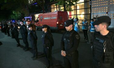 Police officers stand guard at the entrance of the hotel where British singer Liam Payne died in Buenos Aires on Wednesday.