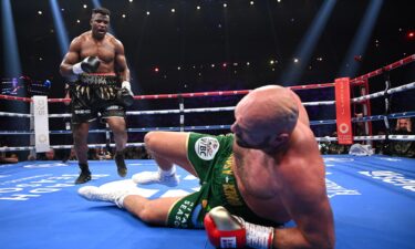 Francis Ngannou knocks down Tyson Fury during their heavyweight fight at Boulevard Hall on October 28