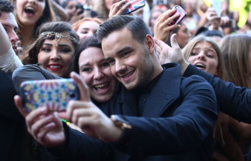 Liam Payne from One Direction takes a selfie with fans in 2014 in Sydney