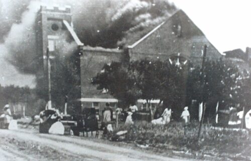 Mt. Zion Baptist Church burns after being torched by White mobs during the 1921 Tulsa race riot.