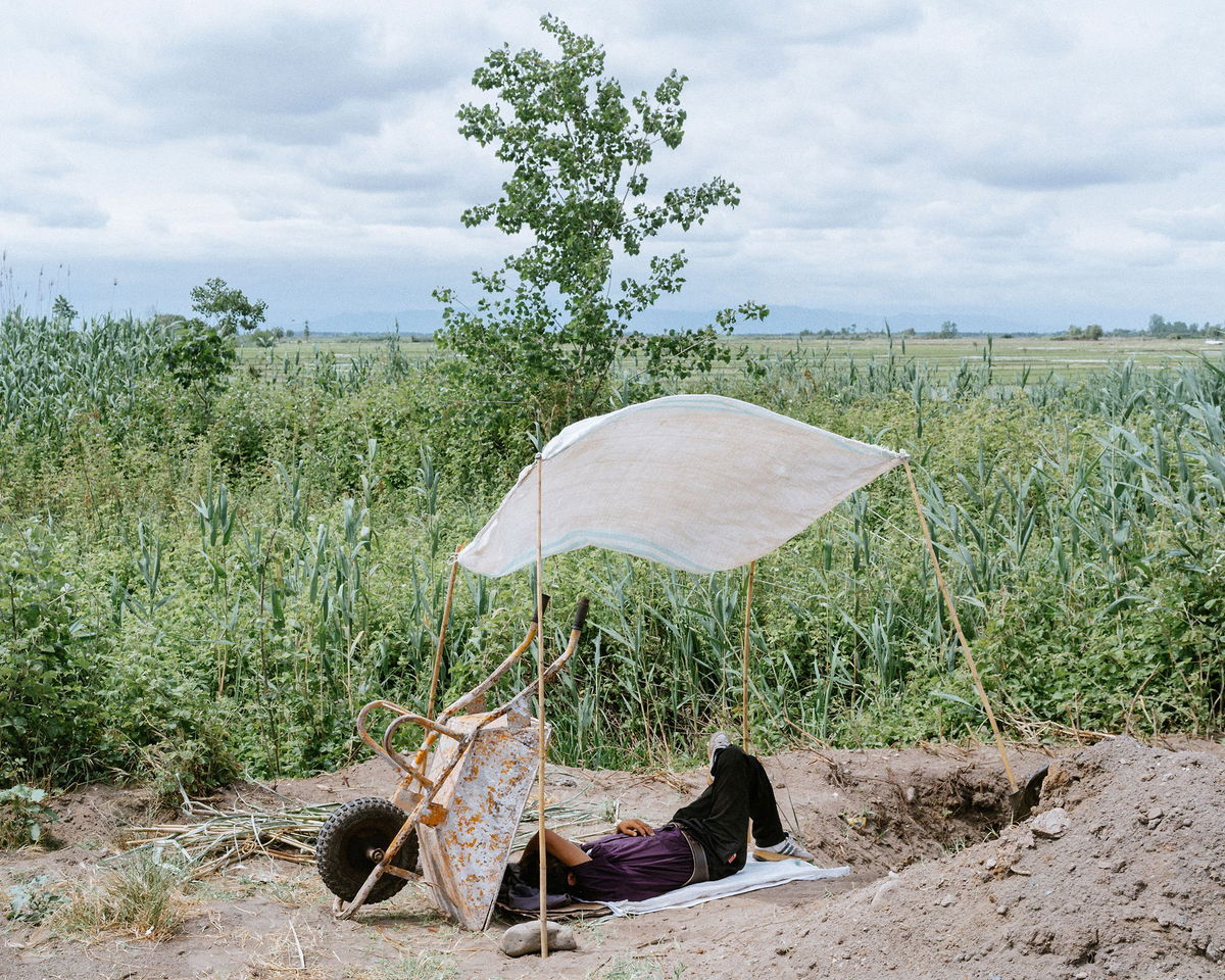 <i>Khashayar Javanmardi 2024 courtesy Loose Joints via CNN Newsource</i><br/>May 2020: A farmer rests while water is pumping from the lagoon to his farm. Extracting water directly from the lagoon has no regulation.