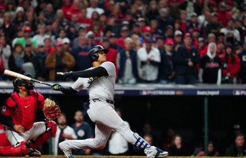 Juan Soto #22 of the New York Yankees hits a three-run home run in the 10th inning during Game 5 of the ALCS.