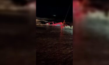 A truck is seen submerged in flood waters in Hagerman