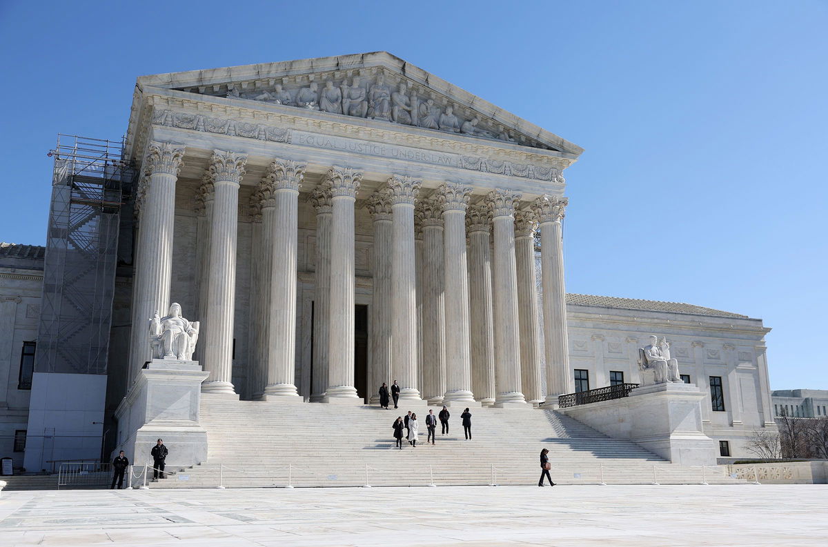 <i>Kevin Dietsch/Getty Images via CNN Newsource</i><br/>People leave the US Supreme Court on February 21 in Washington