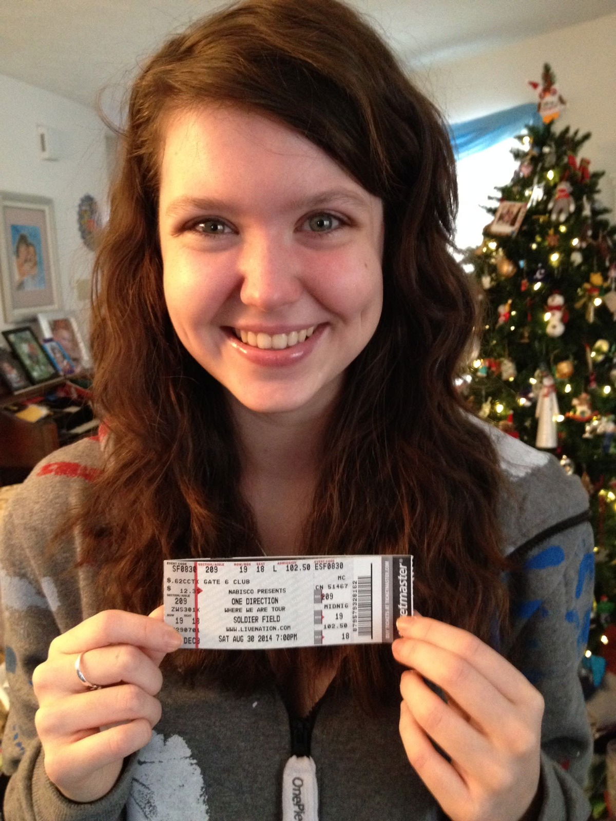 <i>Mikaela Dee via CNN Newsource</i><br/>Mikaela Dee poses in 2013 after receiving her very first One Direction concert tickets for the Where We Are Tour.