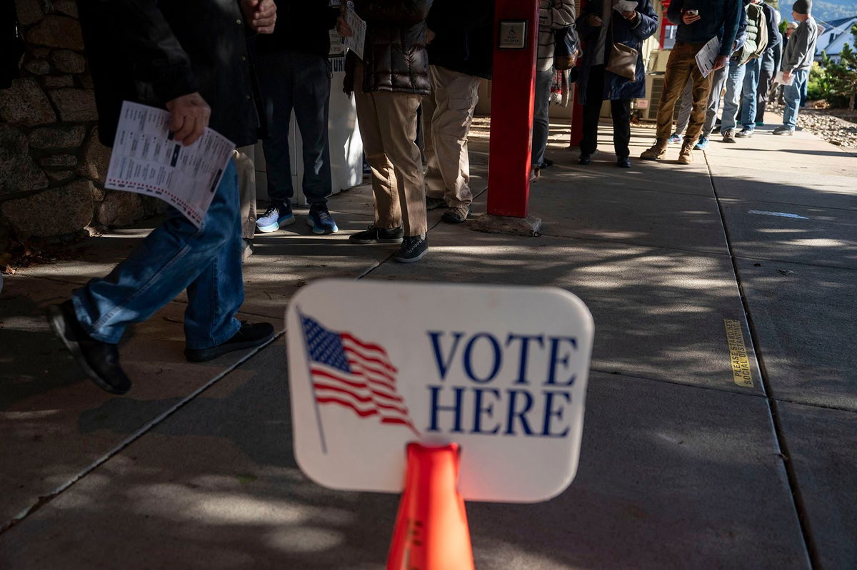 <i>Allison Joyce/AFP/Getty Images via CNN Newsource</i><br/>People wait in line to cast their ballots during early voting at a polling station in Black Mountain