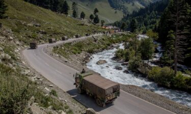 An Indian army convoy drives towards Leh