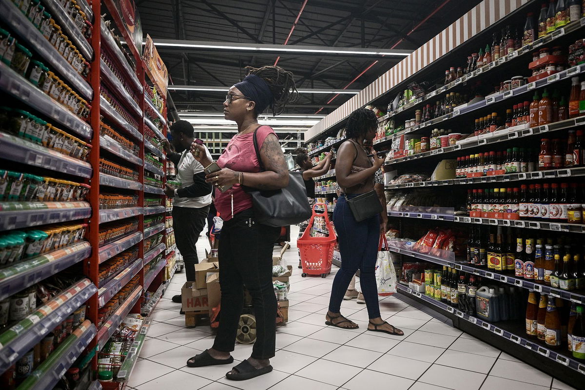 <i>Philippe Lopez/AFP/Getty Images via CNN Newsource</i><br/>Shoppers at a supermarket in Fort-de-France on the French Caribbean island of Martinique on October 14. The island has been rocked by riots over rising prices.