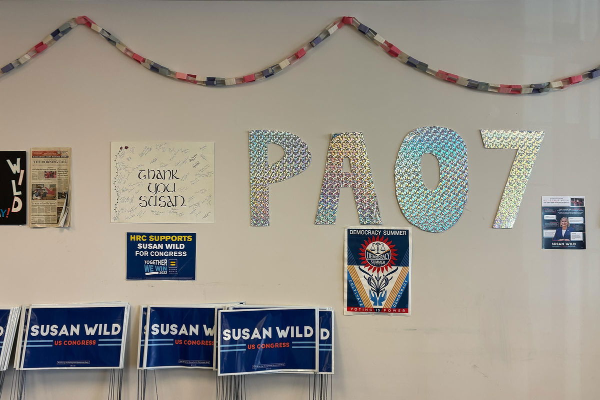 <i>Sarah Ferris/CNN via CNN Newsource</i><br/>Yard signs for US Rep. Susan Wild of Pennsylvania lean against the wall in Allentown