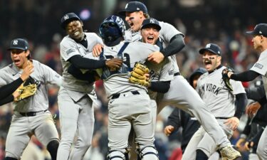 The New York Yankees celebrate after beating the Cleveland Guardians in Game 5 of the ALCS to clinch a World Series berth.