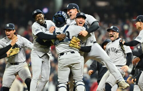 The New York Yankees celebrate after beating the Cleveland Guardians in Game 5 of the ALCS to clinch a World Series berth.