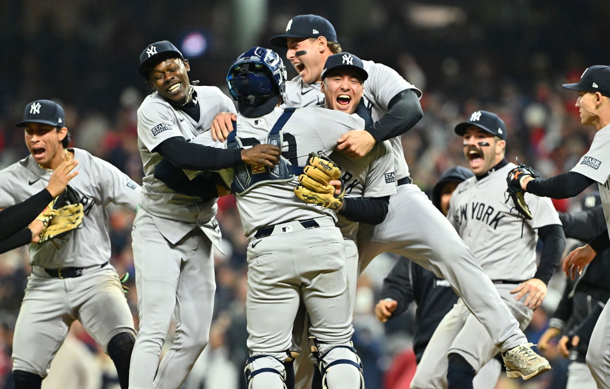 <i>Jason Miller/Getty Images via CNN Newsource</i><br/>The New York Yankees celebrate after beating the Cleveland Guardians in Game 5 of the ALCS to clinch a World Series berth.