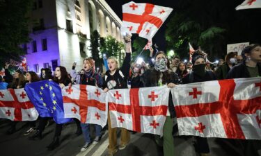 Protesters rally against the "foreign influence" law outside the parliament in Tbilisi on May 15.