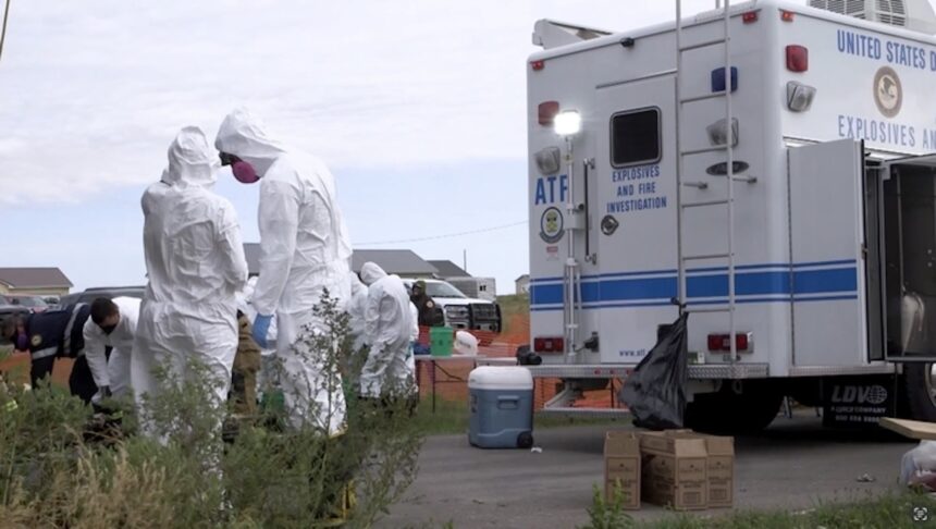 <i>FBI via CNN Newsource</i><br/>Federal agents respond to a crime scene as part of 