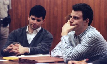 Erik Menendez (R) and brother Lyle listen to court proceedings during a May 17