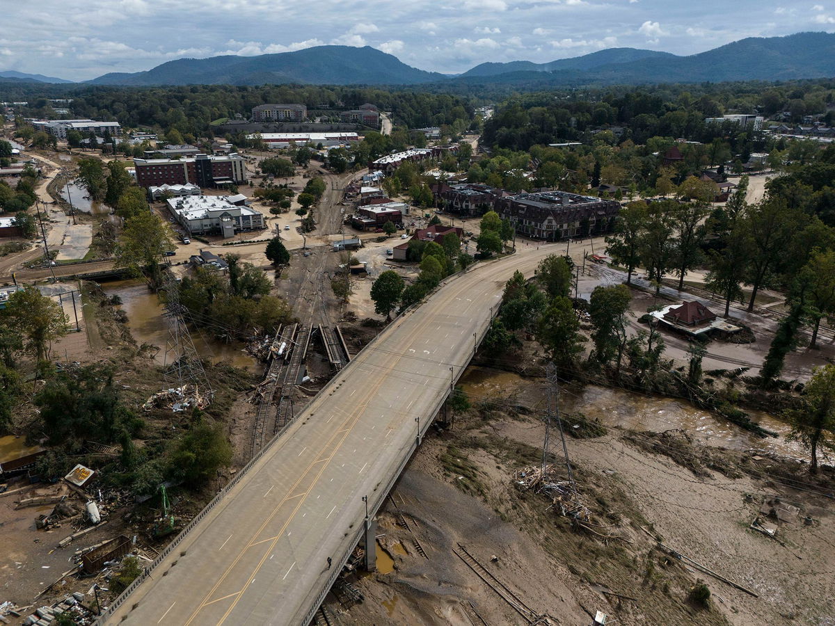 <i>Mike Stewart/AP via CNN Newsource</i><br/>Mud and debris cover Asheville